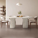 Troia Light Travertine Oval Dining Table with Fluted Round Legs
